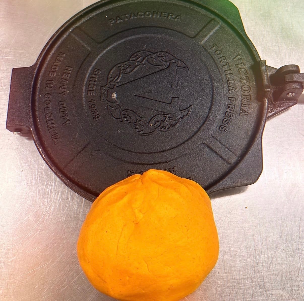 Victoria tortilla press — Made in Colombia — with a dough ball